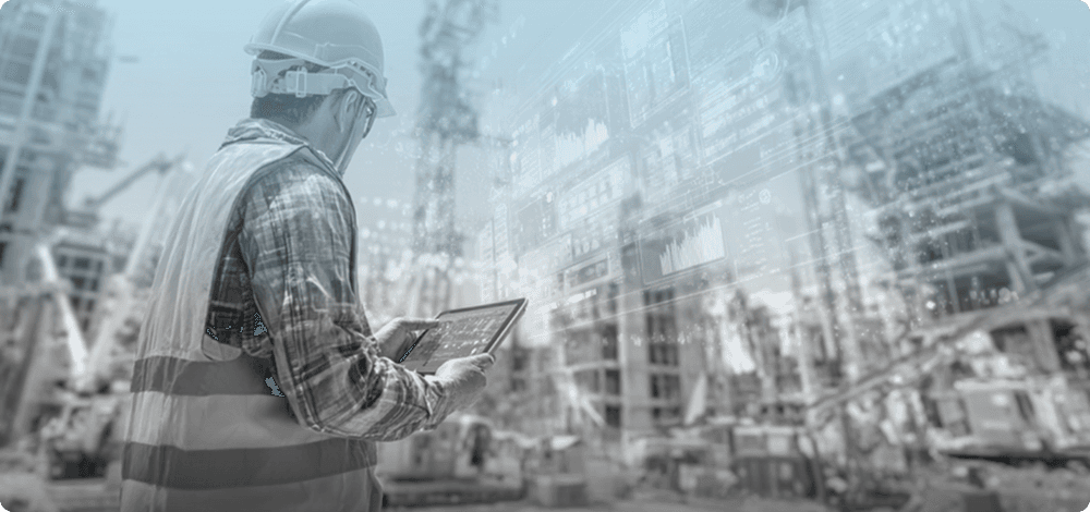 Home builder reviewing permits on a tablet at a construction site