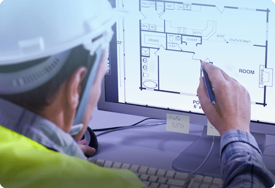 Architect reviewing digital blueprints