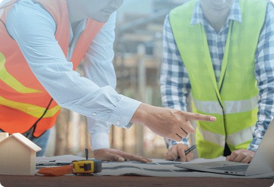 Construction engineer reviewing complex permitting rules on a tablet